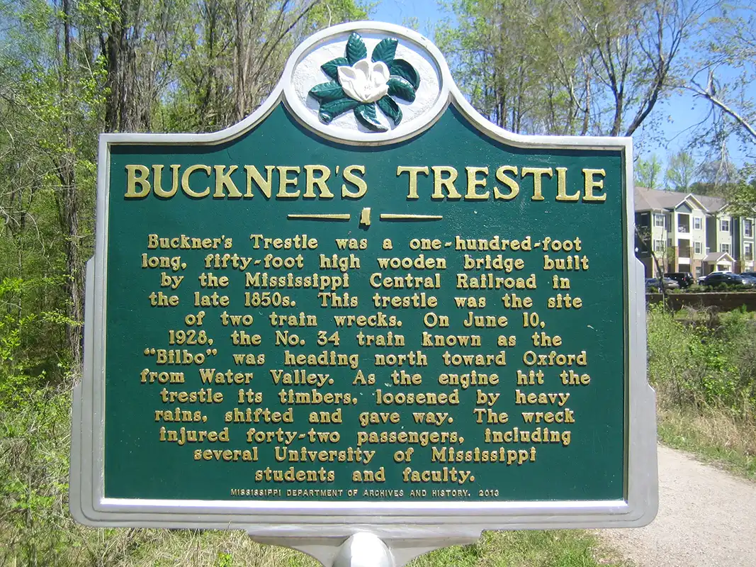This marker is rare because it has a different message on each side. This side explains the train wreck of 1928 at Buckner's Trestle. The marker is on the Thacker Mt. Rail Trail that parallels Old Taylor Road south of Oxford. Set GPS to 16 CR 3062 and walk on trail.