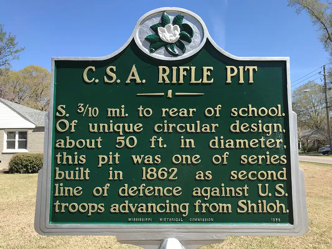 This marker for C.S.A. Rifle Pit is in a private yard east of Corinth at 1105 Shiloh Road.
