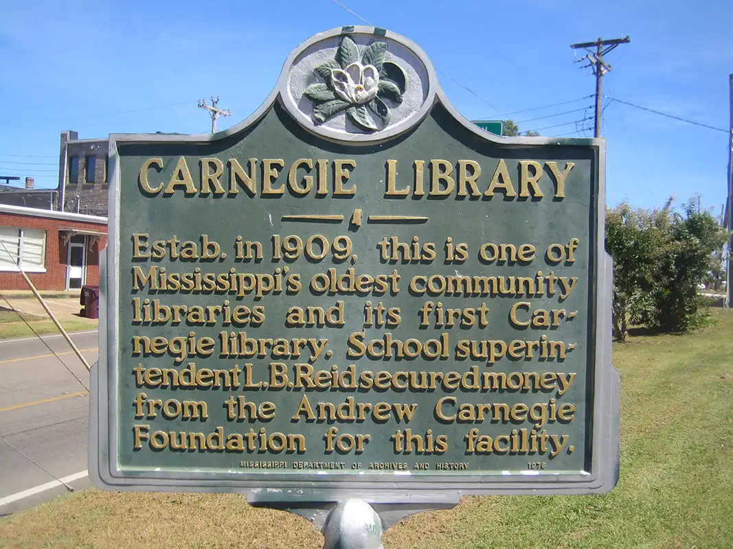 This marker for a Carnegie Library is on W. Madison St. (Highway 8), about one block west of the downtown square in Houston.