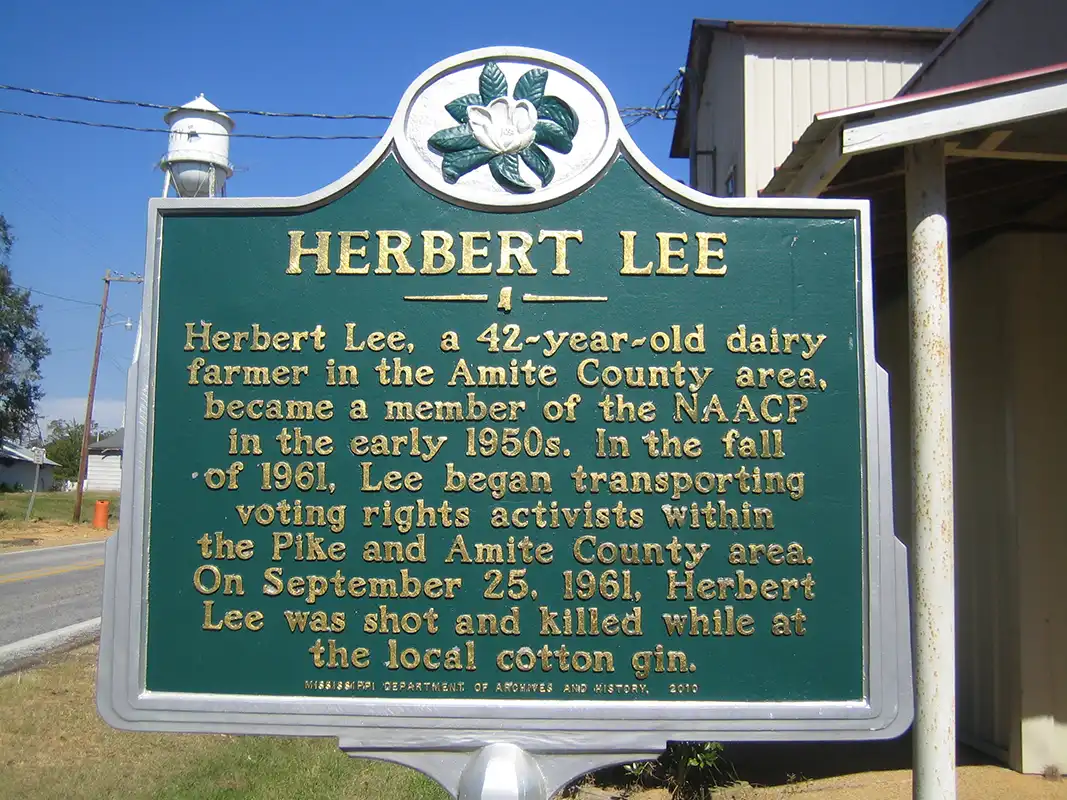 This marker for Herbert Lee is a block south of Main Street on Highway 584 at the old Westbrook Cotton Gin in Liberty.