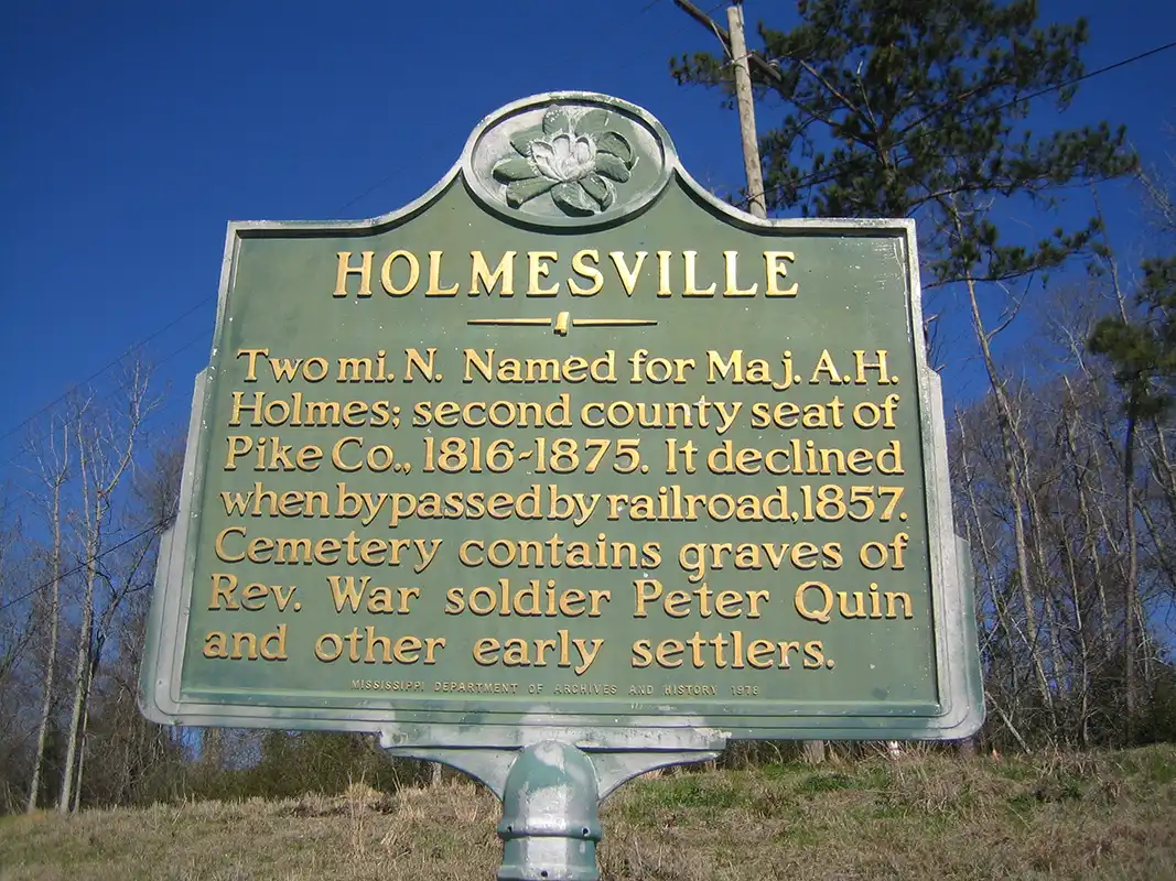 This maker for Holmesville is on Hwy 98 at intersection with Pike 93, about 7 miles east of McComb.