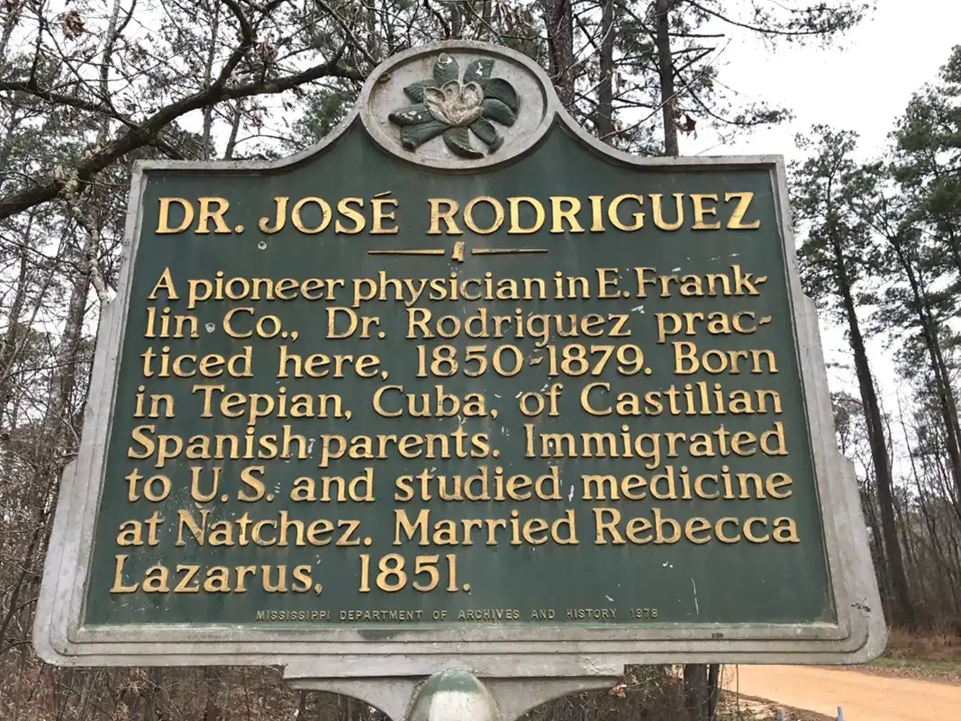 This marker for Dr. Jose Rodriguez is 1.1 miles east of Wright's Bethesda Methodist Church in McCall Creek in Franklin County on a dirt road called Choctaw Road. GPS is Lat: 31.60046, Longitude: 90.70860.