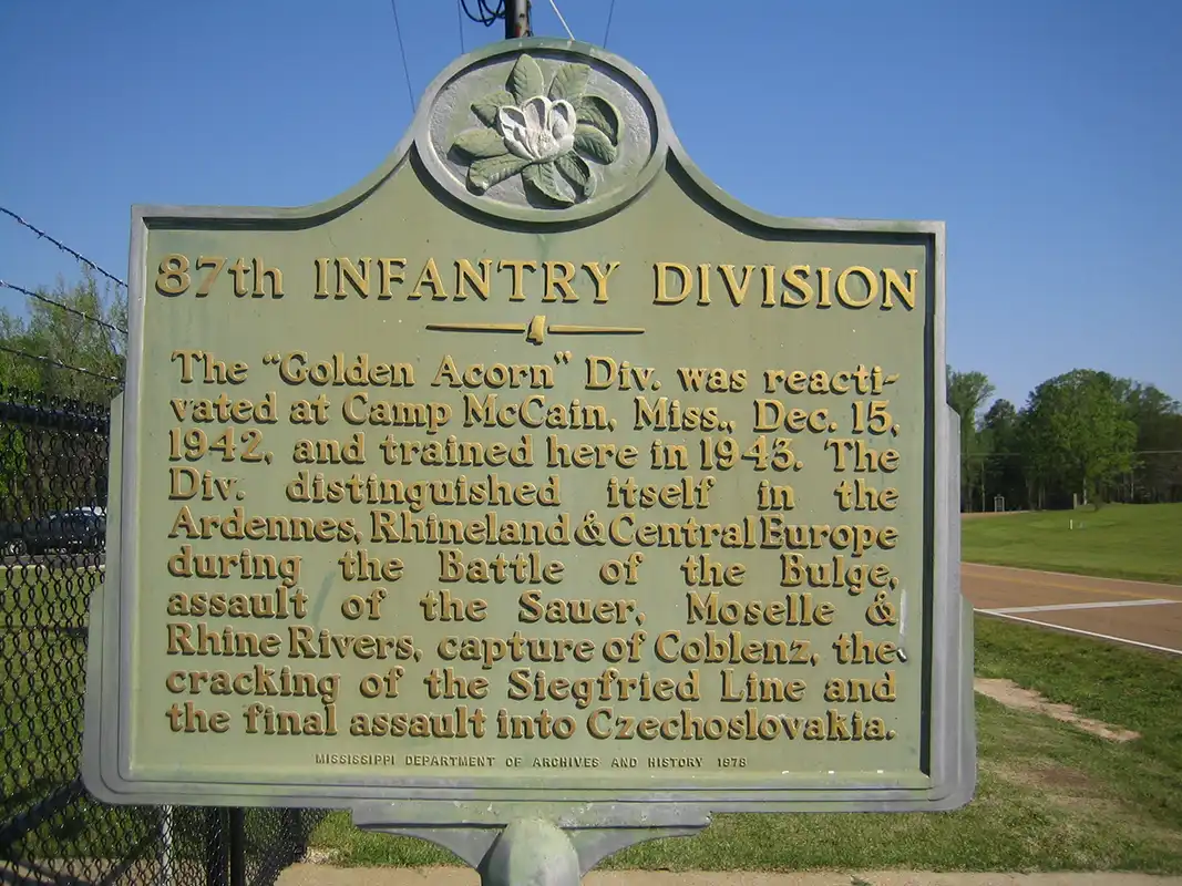 The 87th Infantry Division marker is located at Camp McCain Headquarters at 1352 James H. Biddy Road, south of Grenada.