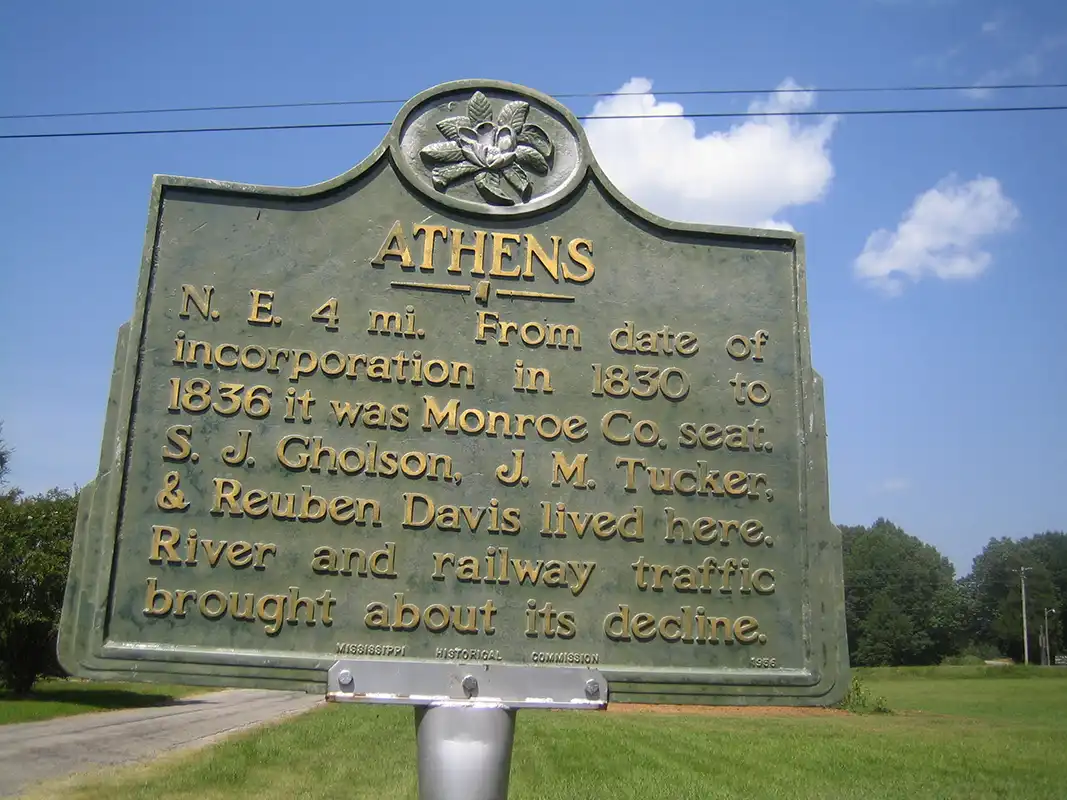 From Amory, go south on Highway 25 through Becker and turn east on Greenbriar Road, which ends at Athens after 6 miles. The marker is in front of the Old Jail, visible from Athens Baptist Church.