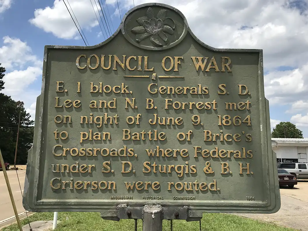 This marker for Council of War is at the corner of State Street and S. Second Street (Hwy 145) in Booneville.