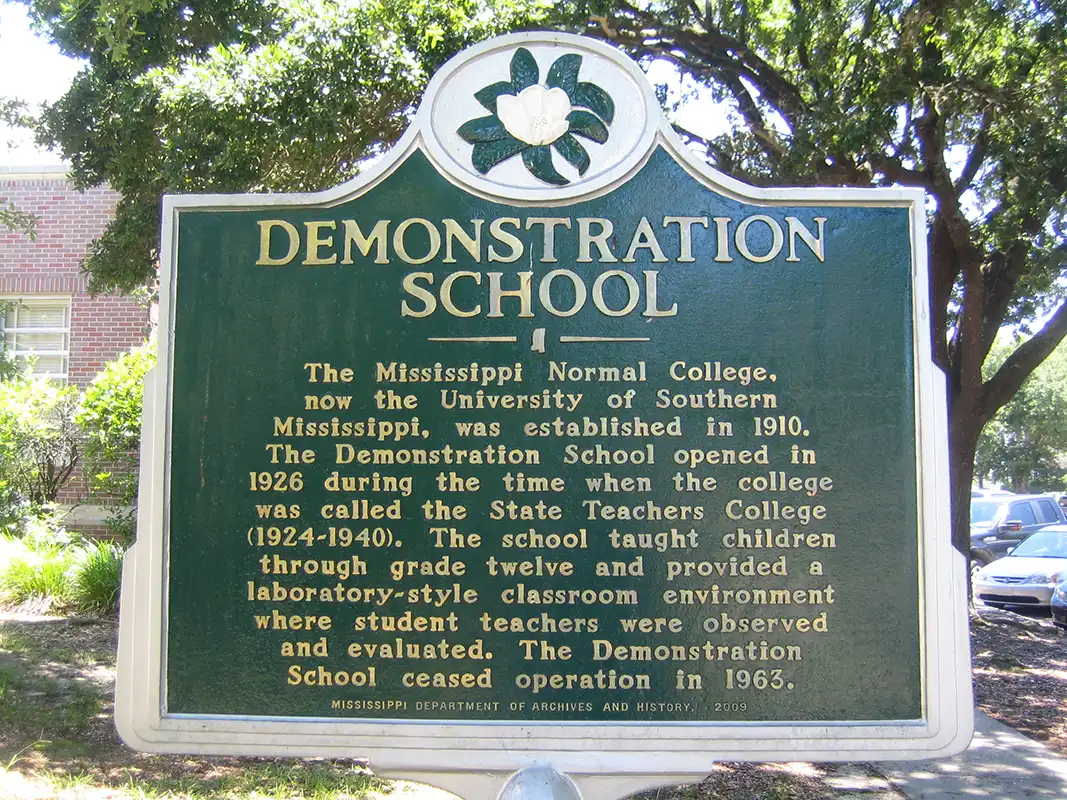 This marker for a Demonstration School is in front of the George Hurst Building on the campus of the University of Southern Mississippi.