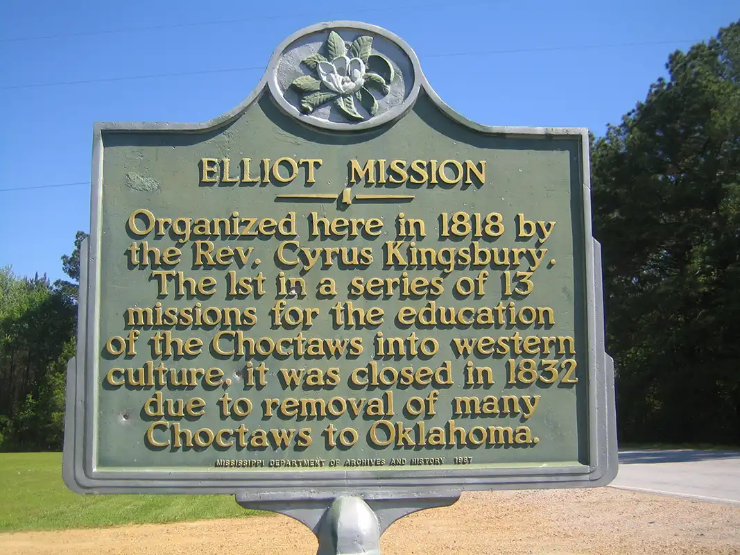 The Elliot Mission marker is about 1.5 miles south of Holcomb on Highway 35.