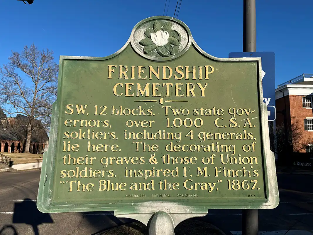 The Friendship Cemetery marker is in downtown Columbus on Main St. at the intersection with 7th Street.