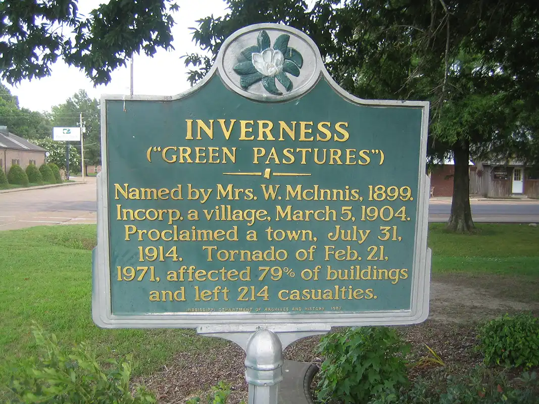 A small town south of Indianola. This marker is at the corner of Third Street and Grand Avenue.