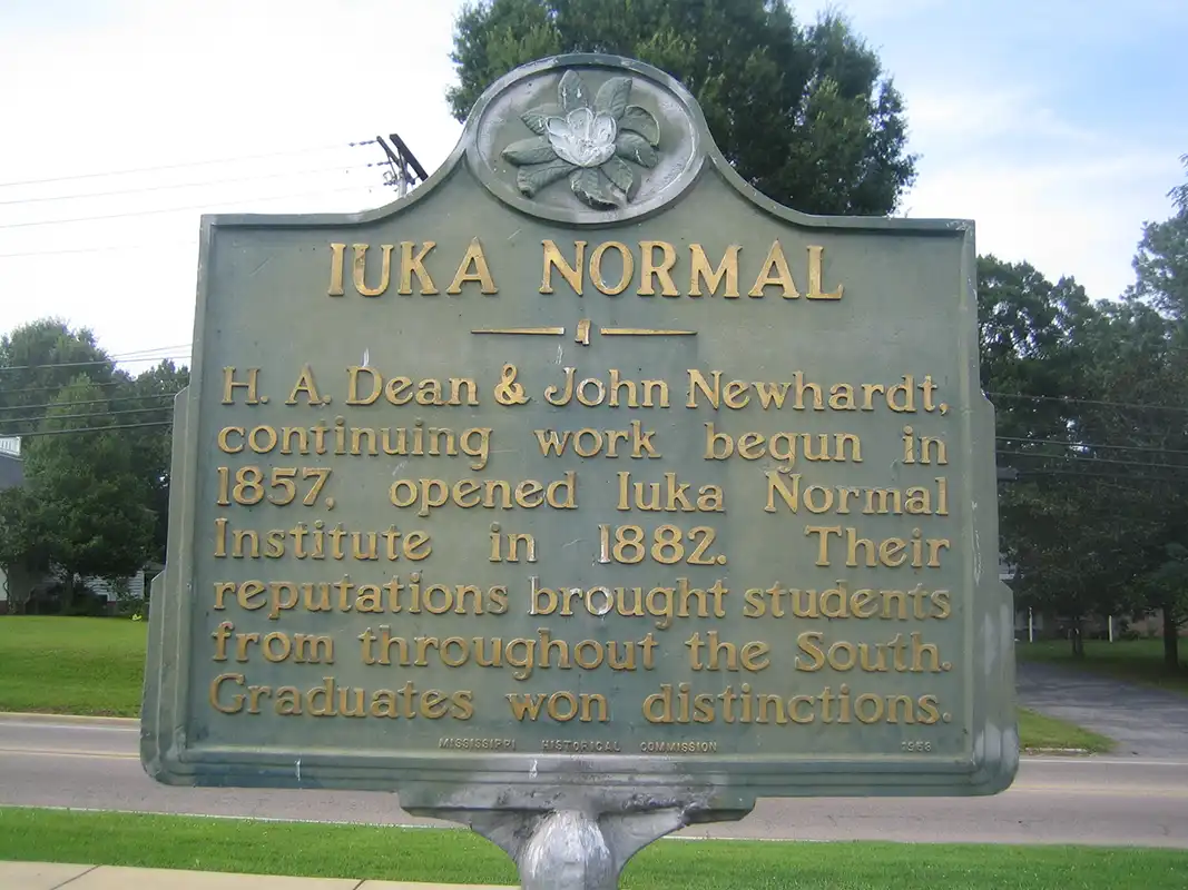 This marker for Iuka Normal School is about a mile east of the Old Tishomingo County Courthouse on the same road.