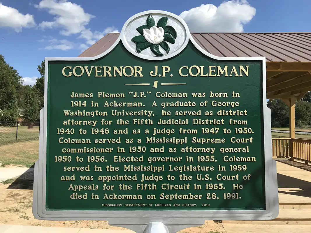 The Governor J.P. Coleman marker is in Governor's Park in downtown Ackerman at the corner of E. Main St. and S. Commerce St.
