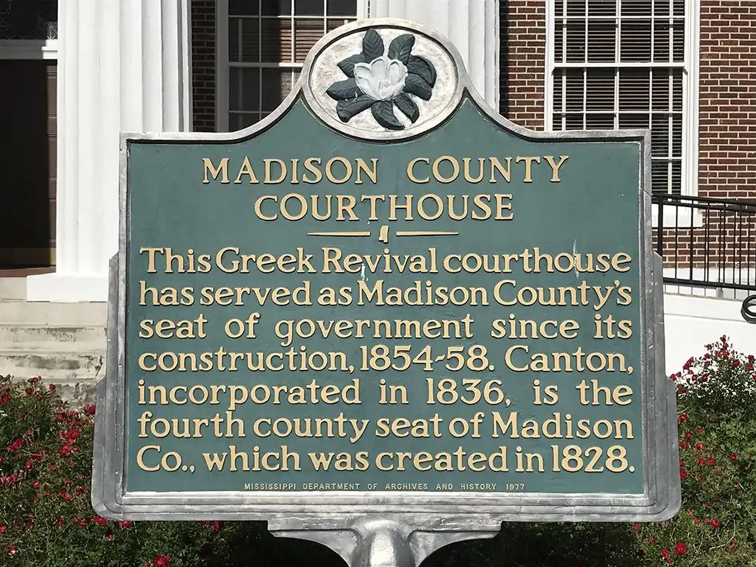 This marker is at the Madison County Courthouse in Canton.