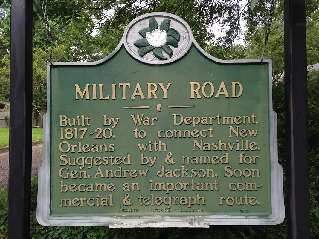 This marker is on Military Road at the corner of 11th Avenue North in Columbus. Jackson's Military Road, surveyed by Captain Hugh Young, ran from Cotton Gin Port to Madisonville, LA, across Lake Pontchartrain from New Orleans.