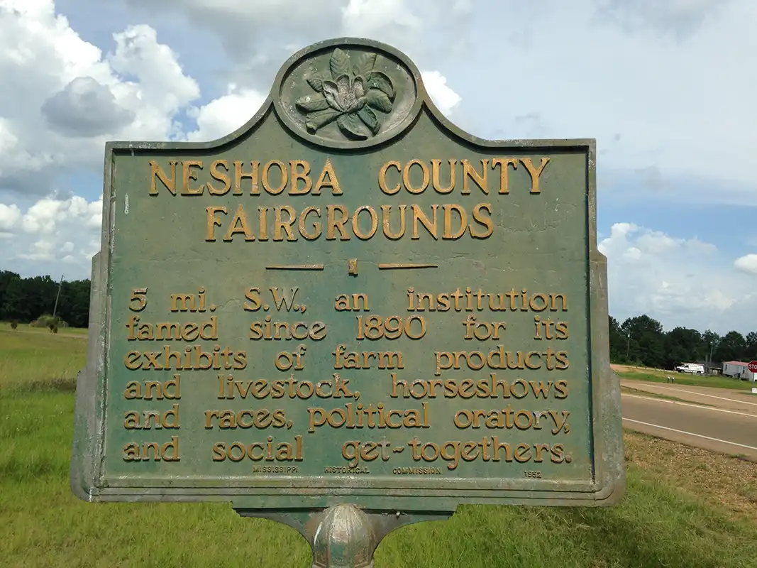 This marker for the Neshoba County Fairgrounds is at the intersection of Hwy 15 and Hwy 21 south of Philadelphia.