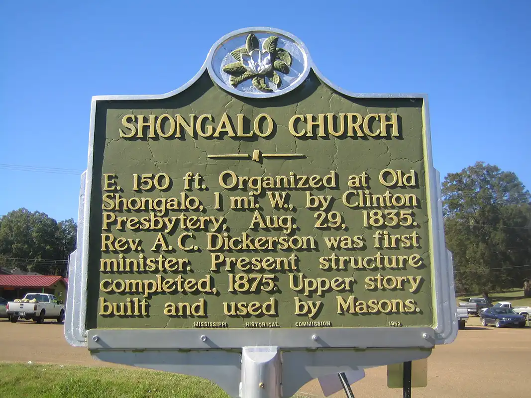The Shongalo Church marker is on Highway 51 by the railroad track in Vaiden, across the street from the Piggly Wiggly.