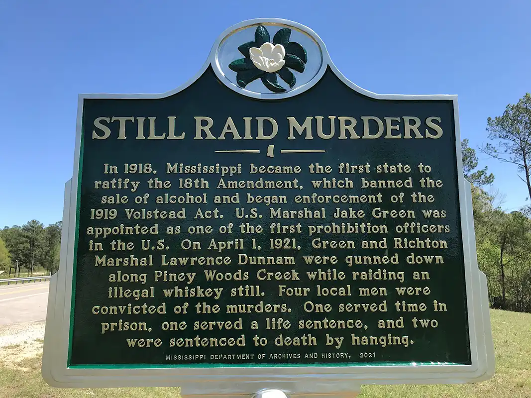 Still Raid Murders marker is on the border of Perry and Greene counties at 19319 Highway 42, about 10 miles east of Richton.