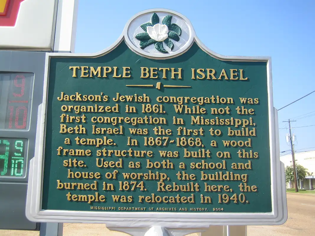 This marker for Temple Beth Israel is at the corner of S. State Street and East South Street, in front of a gas station.