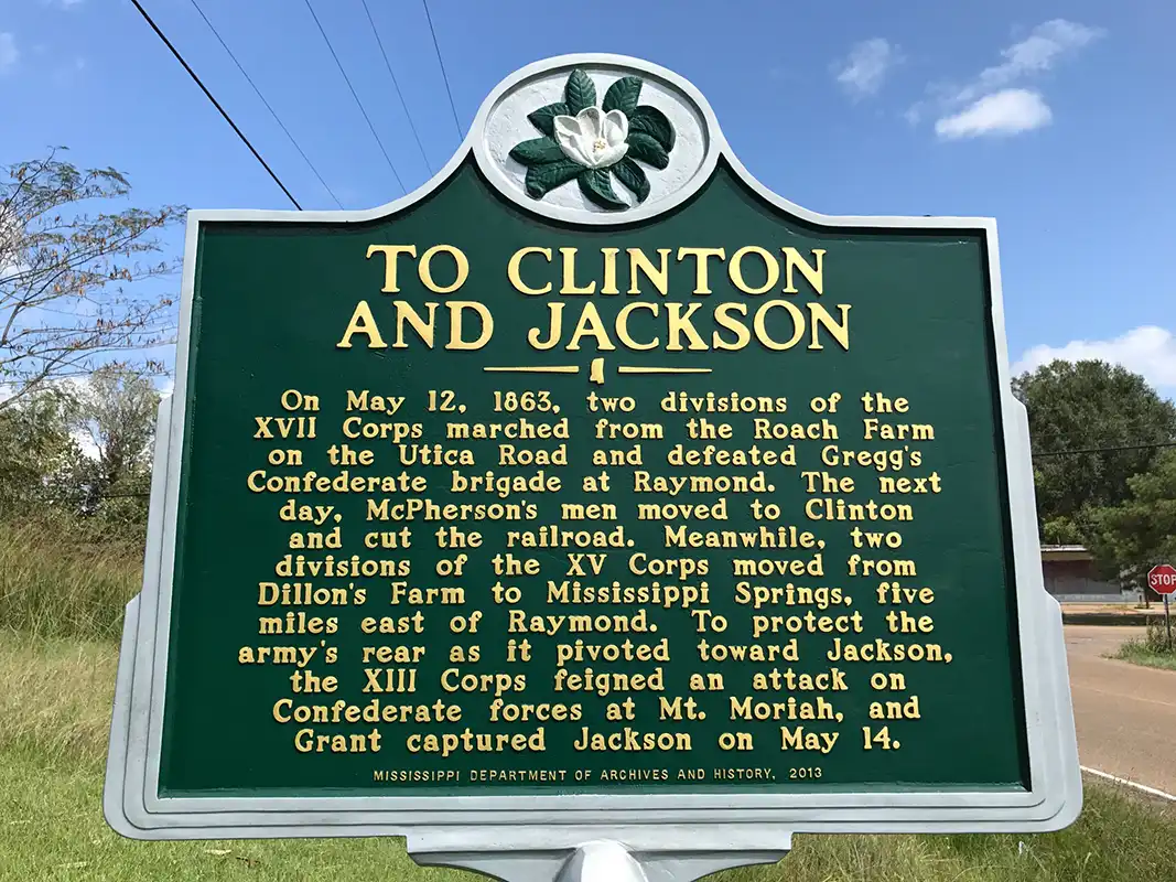 This marker, To Clinton and Jackson, is 1.4 miles south of Raymond on the Old Port Gibson Road at the junction with Port Gibson Street.