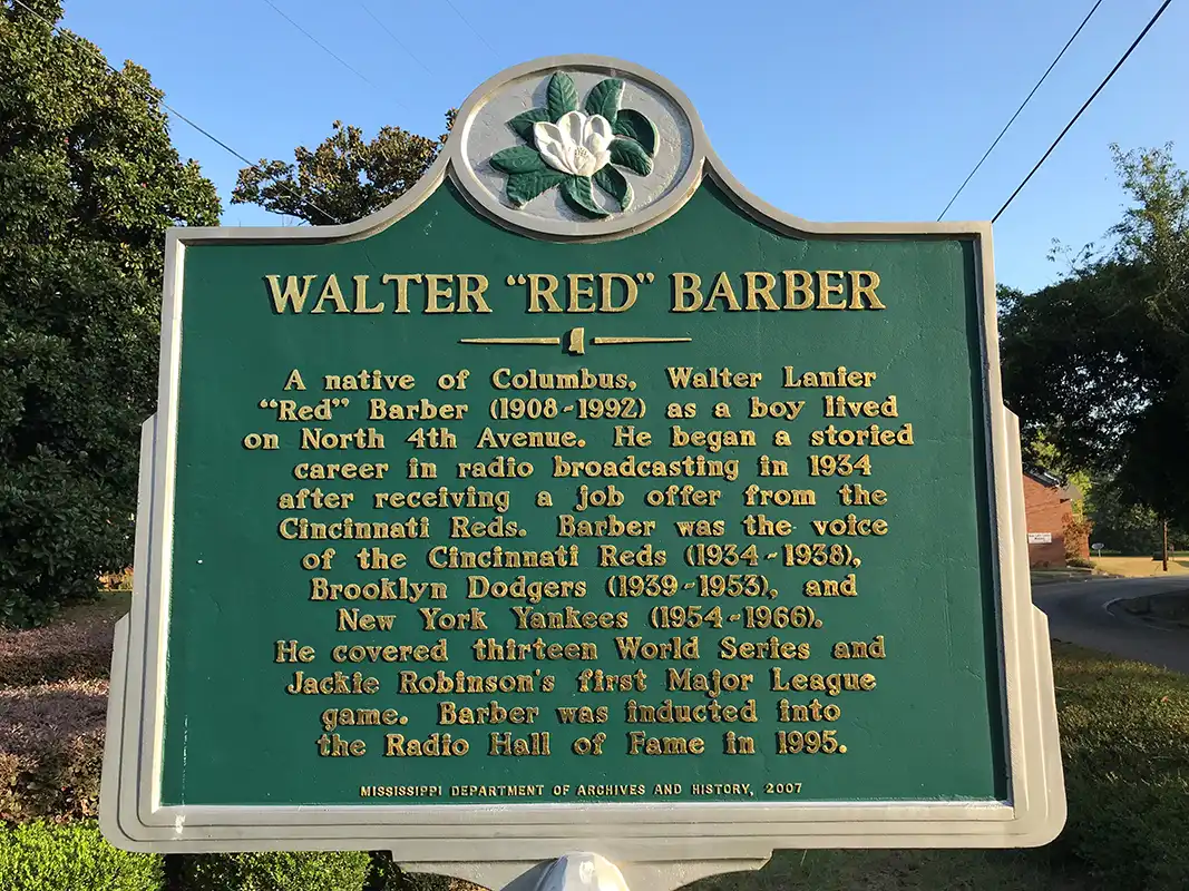 This marker for Walter "Red" Barber is at the intersection of Military Road and Fourth Avenue North, in the median on Military Road in Columbus.