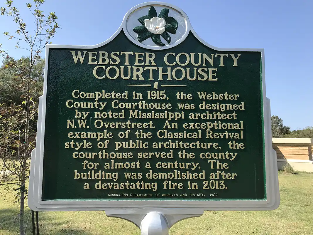 The Webster County Courthouse marker is on Carroll St. where it intersects Courthouse Square in Walthall.